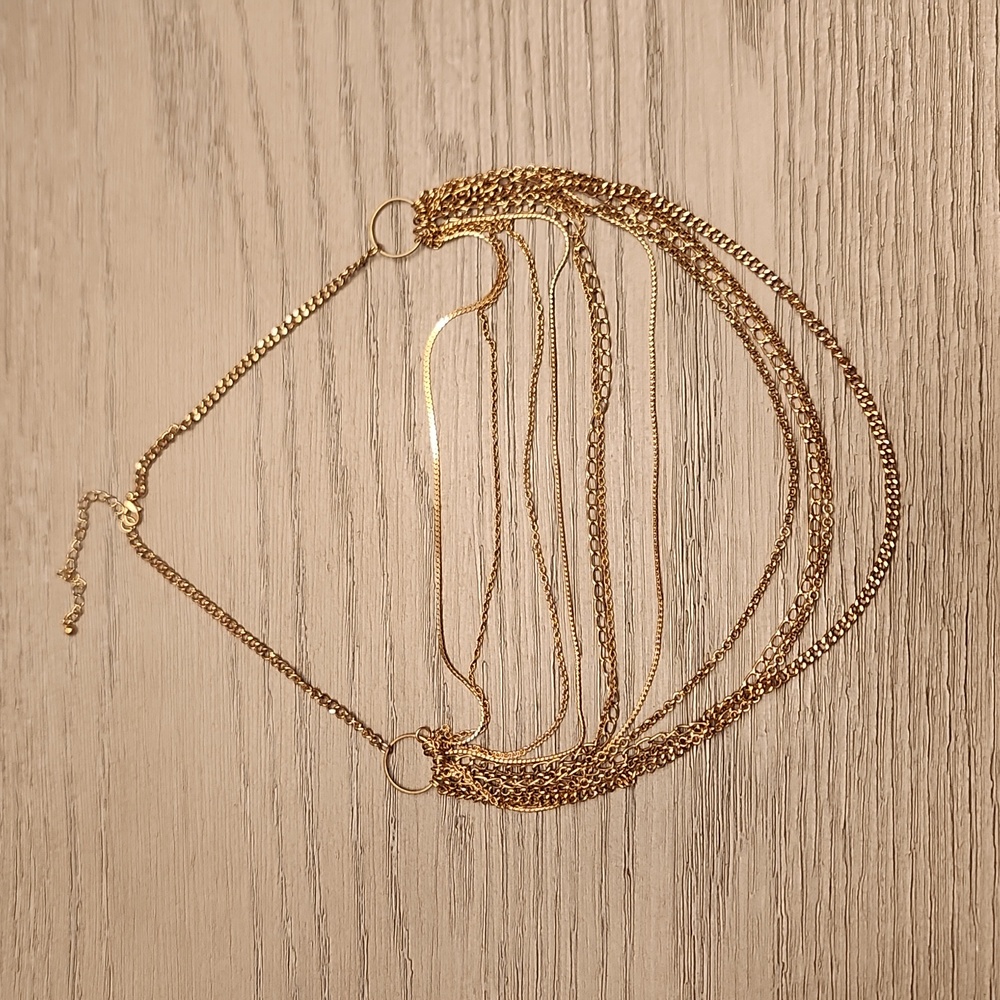 Multi strand gold toned necklace